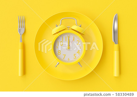Yellow clock on the yellow plate Yellow clock on the yellow plate 58330489