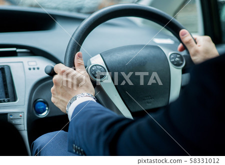 Driving businessman 58331012