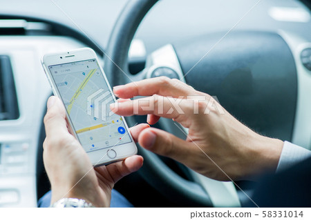 Driving businessman 58331014