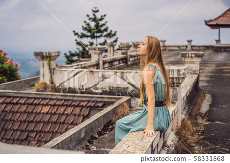 Woman tourist in abandoned and mysterious hotel in Bedugul. Indonesia, Bali Island. Bali Travel 58331868