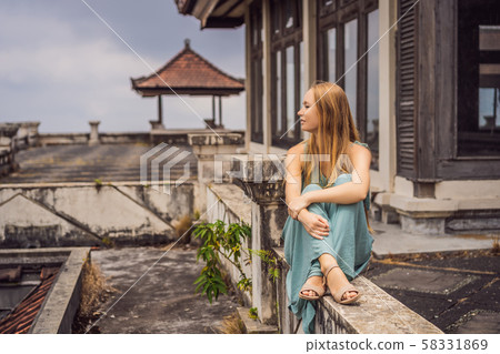 Woman tourist in abandoned and mysterious hotel in Bedugul. Indonesia, Bali Island. Bali Travel Woman tourist in abandoned and mysterious hotel in Bedugul. Indonesia, Bali Island. Bali Travel 58331869