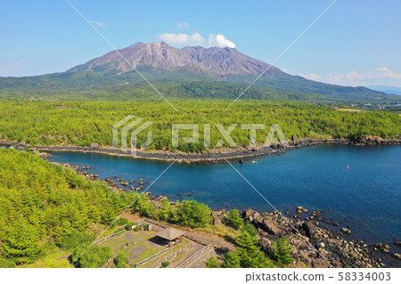 Aerial view of a natural fishing port made of lava on Sakurajima Aerial view of a natural fishing port made of lava on Sakurajima 58334003