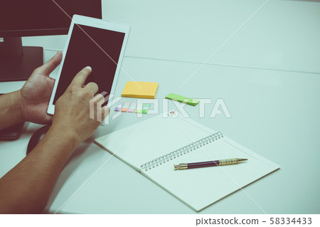 Software engineer touch taplet to check information during creating plan 58334433