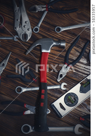 Close up tools on a wooden background. Close up tools on a wooden background. 58335957