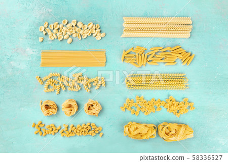 Italian pasta, flat lay banner, shot from the top on a teal blue background 58336527
