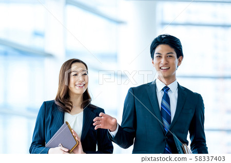 Business image Male employee Female employee 58337403