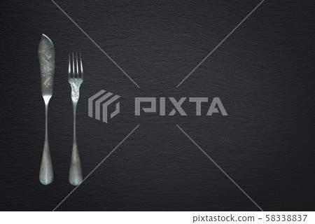 Cutlery for fish on a slate background 58338837
