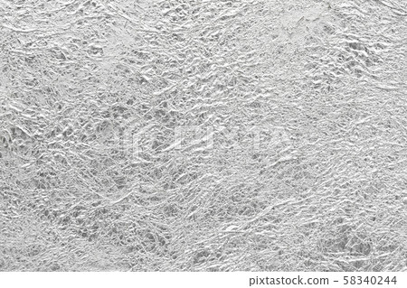 Silver paper crumpled mess glossy shiny texture background. 58340244