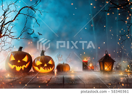 Halloween pumpkins on dark spooky forest. Halloween pumpkins on dark spooky forest. 58340361