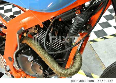 Closed up and selected focused on a big motorcycle engine. Huge engine and latest technology produced high capacity horsepower to the motorcycle. Closed up and selected focused on a big motorcycle engine. Huge engine and latest technology produced high capacity horsepower to the motorcycle. 58340432