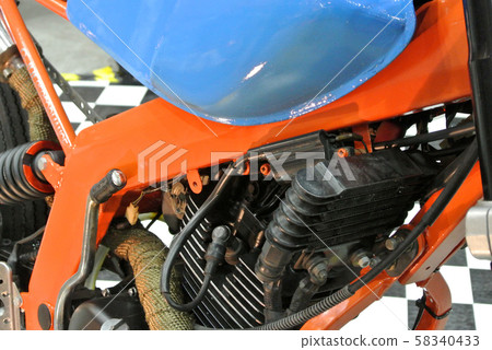 Closed up and selected focused on a big motorcycle engine. Huge engine and latest technology produced high capacity horsepower to the motorcycle.   58340433