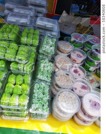 Variety of famous traditional Malaysian sweet and dessert sell by hawkers in the street Ramadhan Bazaar. Homemade food sells in the open market normally held during Muslim Ramadhan month.  58340608