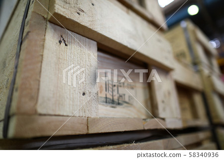 Stack of old wooden packaging boxes standing in column Stack of old wooden packaging boxes standing in column 58340936