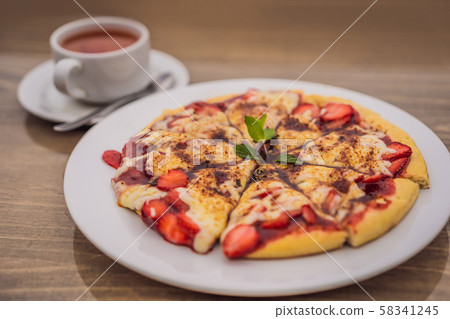 Delicious strawberry pizza on a balinese tropical nature background. Bali island, Indonesia 58341245