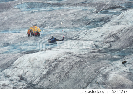 Helicopter And A Group Of Hikers On Mendenhall 58342581