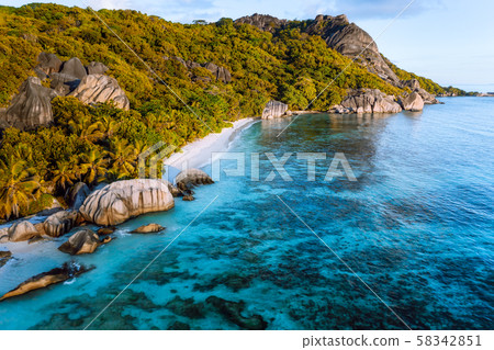 Golden hour at Anse Source D Argent exotic beach at Seychelles. Aerial drone photo from above 58342851