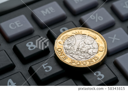 New British one pound coin in studio New British one pound coin in studio 58343815