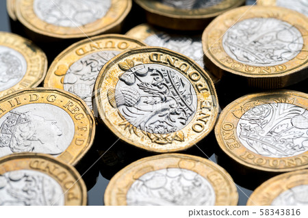 New British one pound coin in studio New British one pound coin in studio 58343816