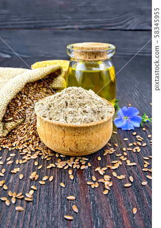Flour linen in bowl with flower and oil Flour linen in bowl with flower and oil 58345955