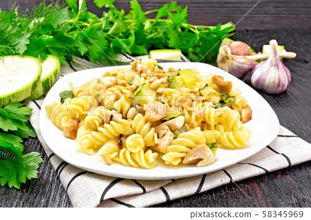 Fusilli with chicken and zucchini in plate Fusilli with chicken and zucchini in plate 58345969
