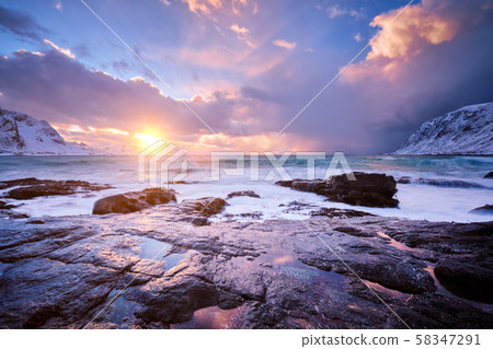 Coast of Norwegian sea on rocky coast in fjord on sunset 58347291