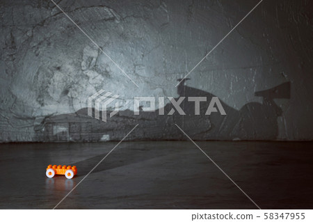 Plastic building blocks with formula racing car shadow . Creative and ideal concept . Concrete interior background . Plastic building blocks with formula racing car shadow . Creative and ideal concept . Concrete interior background . 58347955