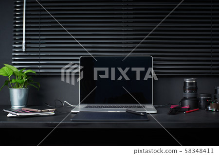 Work space on black table of a photographer or designer with laptop , retro camera , Stylish home studio concept of hipster . Seleted focus. Work space on black table of a photographer or designer with laptop , retro camera , Stylish home studio concept of hipster . Seleted focus. 58348411
