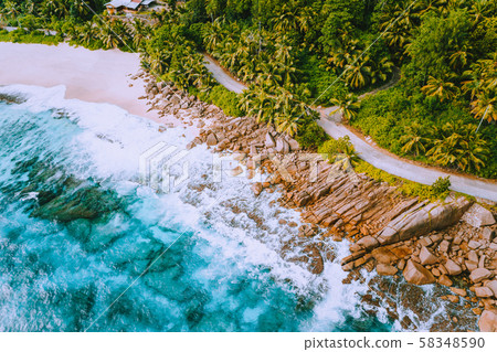 Aerial view of beautiful secluded beach on Mahe island at Seychelles Aerial view of beautiful secluded beach on Mahe island at Seychelles 58348590