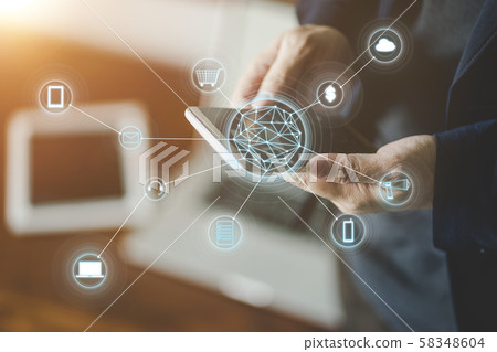 Man holding smart phone making online shopping and banking payment. Blurred background . Man holding smart phone making online shopping and banking payment. Blurred background . 58348604
