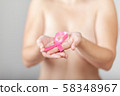 Beautiful Nude woman hold pink ribbon in hand 58348967