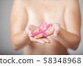 Beautiful Nude woman hold pink ribbon in hand 58348968