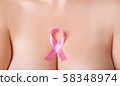 Beautiful Nude woman breast with pink ribbon 58348974
