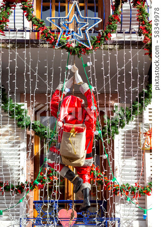 Alsace. Facades of houses decorated for Christmas. 58349978