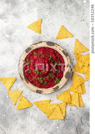 Beetroot hummus in a bowl on gray board 58352246