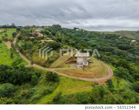 Aerial view of luxury villa in tropical valley 58352344