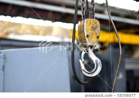 Bridge lifting Crane Hook against the background of the Assembly Line industrial factory Bridge lifting Crane Hook against the background of the Assembly Line industrial factory 58356077