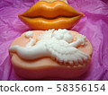 Bright orange lips. Kiss. White angel on a pink background. Cupid. Valentine's Day. Best gift. Fragrant soap.    58356154