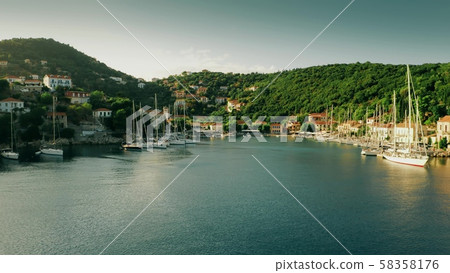 Low altitude aerial shot of Kioni Bay of Ithaca island, Greece Low altitude aerial shot of Kioni Bay of Ithaca island, Greece 58358176