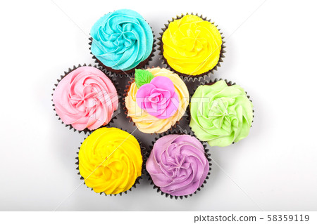 Overhead View of Cupcakes With Colorful Icing or Frosting Overhead View of Cupcakes With Colorful Icing or Frosting 58359119