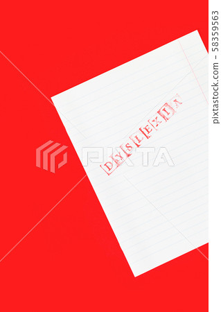 Dyslexia word stamped on notebook page on red Dyslexia word stamped on notebook page on red 58359563
