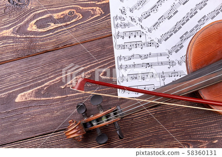 Violin, fiddle stick and musical notes. Violin, fiddle stick and musical notes. 58360131