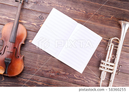 Old violin, trumpet and musical notes. Old violin, trumpet and musical notes. 58360255