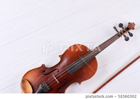 Violin with fiddle stick and copy space. 58360302