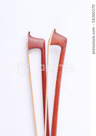 Brown violin fiddle stick, top view. 58360370