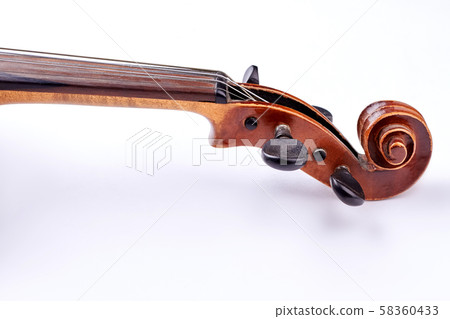 Scroll of the violin on white background. Scroll of the violin on white background. 58360433