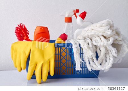 Cleaning products and supplies in basket. 58361127