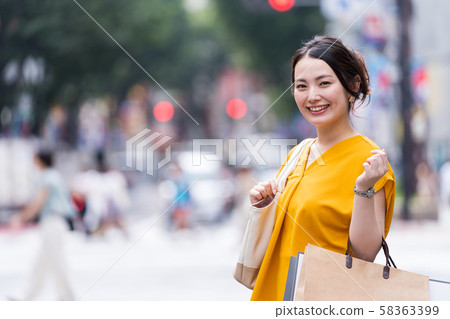 Young woman, shopping, outdoors 58363399