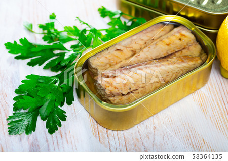 Scomber fillets in sunflower oil with parsley and lemon Scomber fillets in sunflower oil with parsley and lemon 58364135