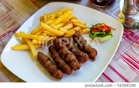 Grilled dish of minced meat Cevapcici Grilled dish of minced meat Cevapcici 58364190