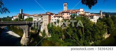 Devils bridge with cathedral at the background. Cividale del Friuli. Italy 58364263